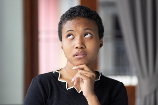 thoughtful black woman thinking planning portrait black african woman looking up thinking finding good idea plan decision 46728 3190
